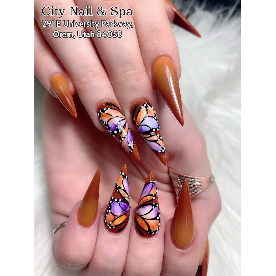 Suggestions for stiletto nail designs with butterfly pattern Creative